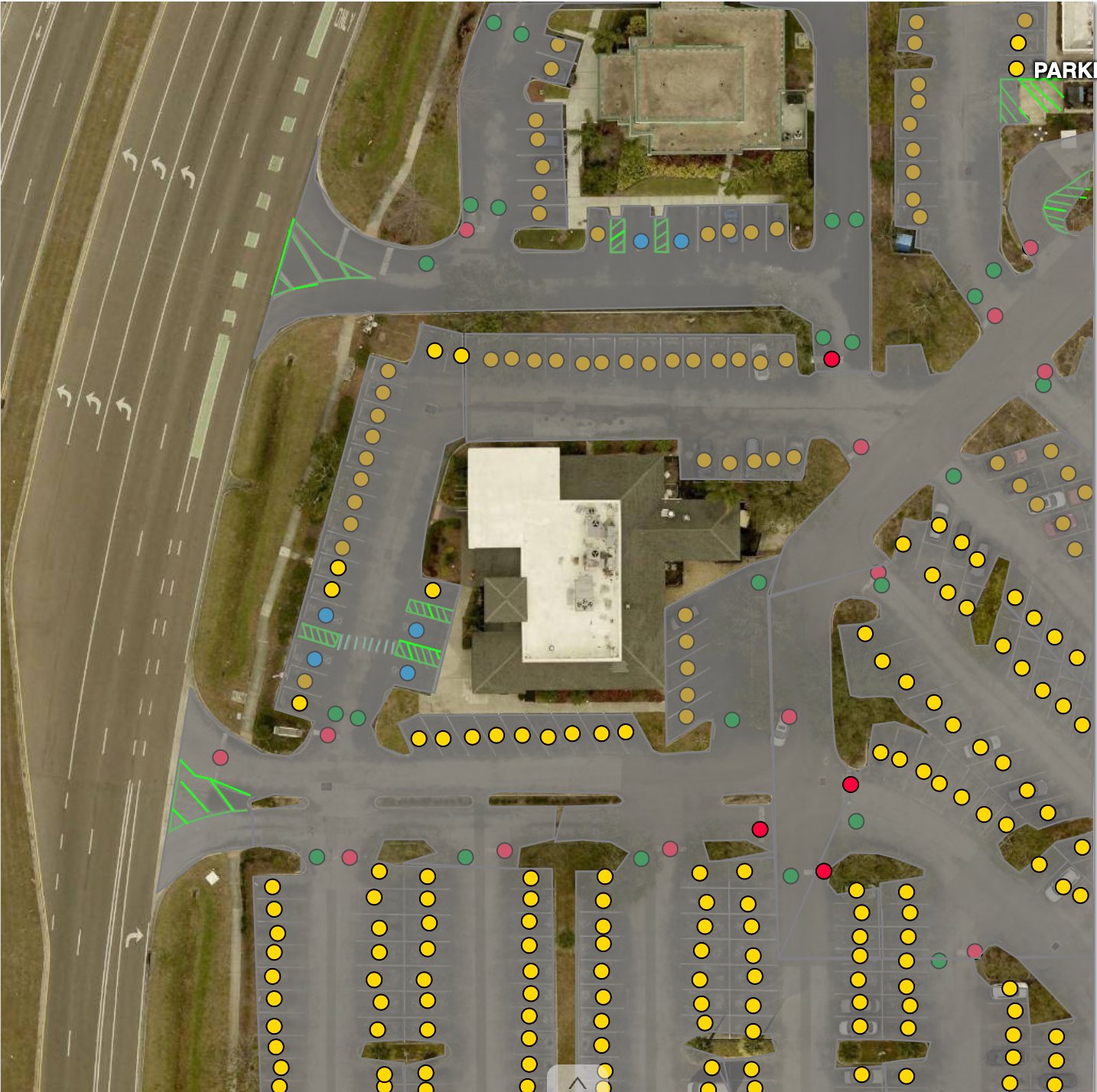 AI-detected parking stalls, arrows, and surfaces overlaid on satellite imagery